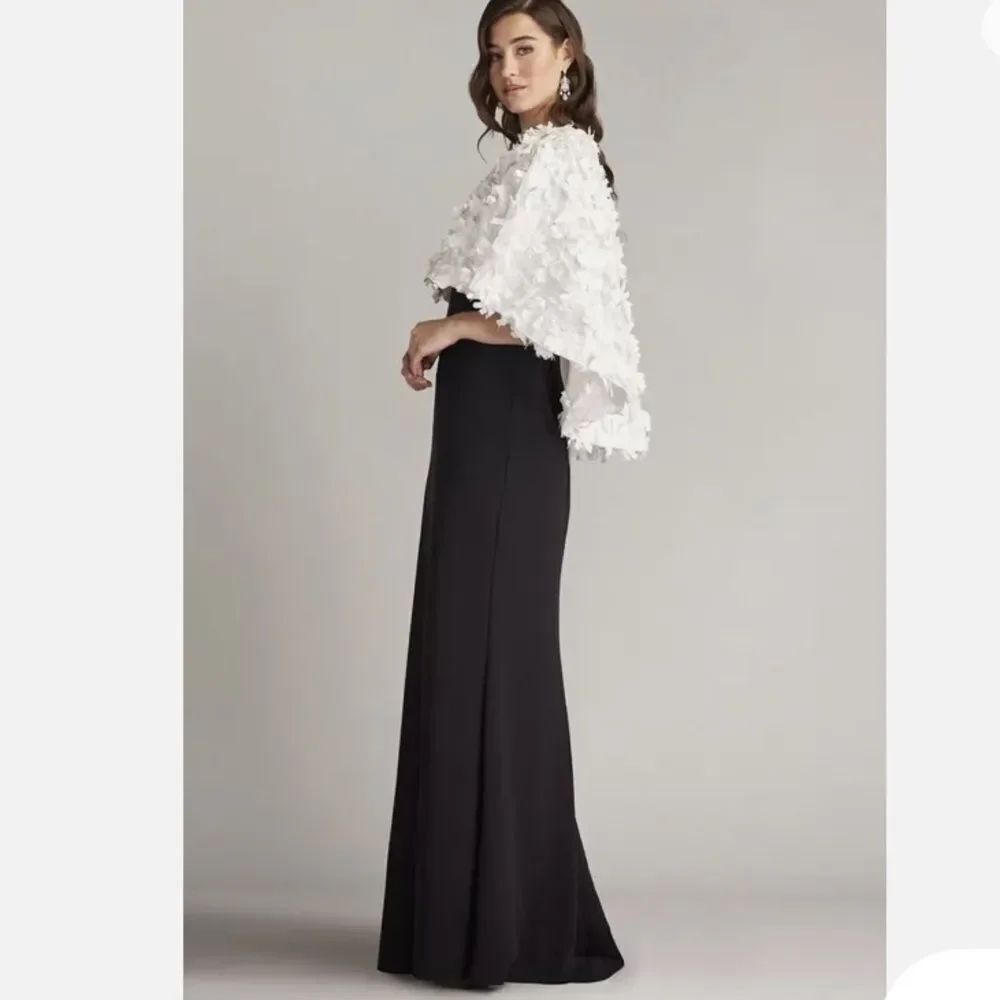 Evening Gown by Tadashi Shoji
3D Floral Cape-Sleeve Gown